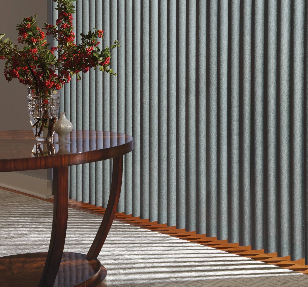 Wooden table set in front of a picture window decorated with fabric Hunter Douglas Vertical Blinds near El Dorado, California