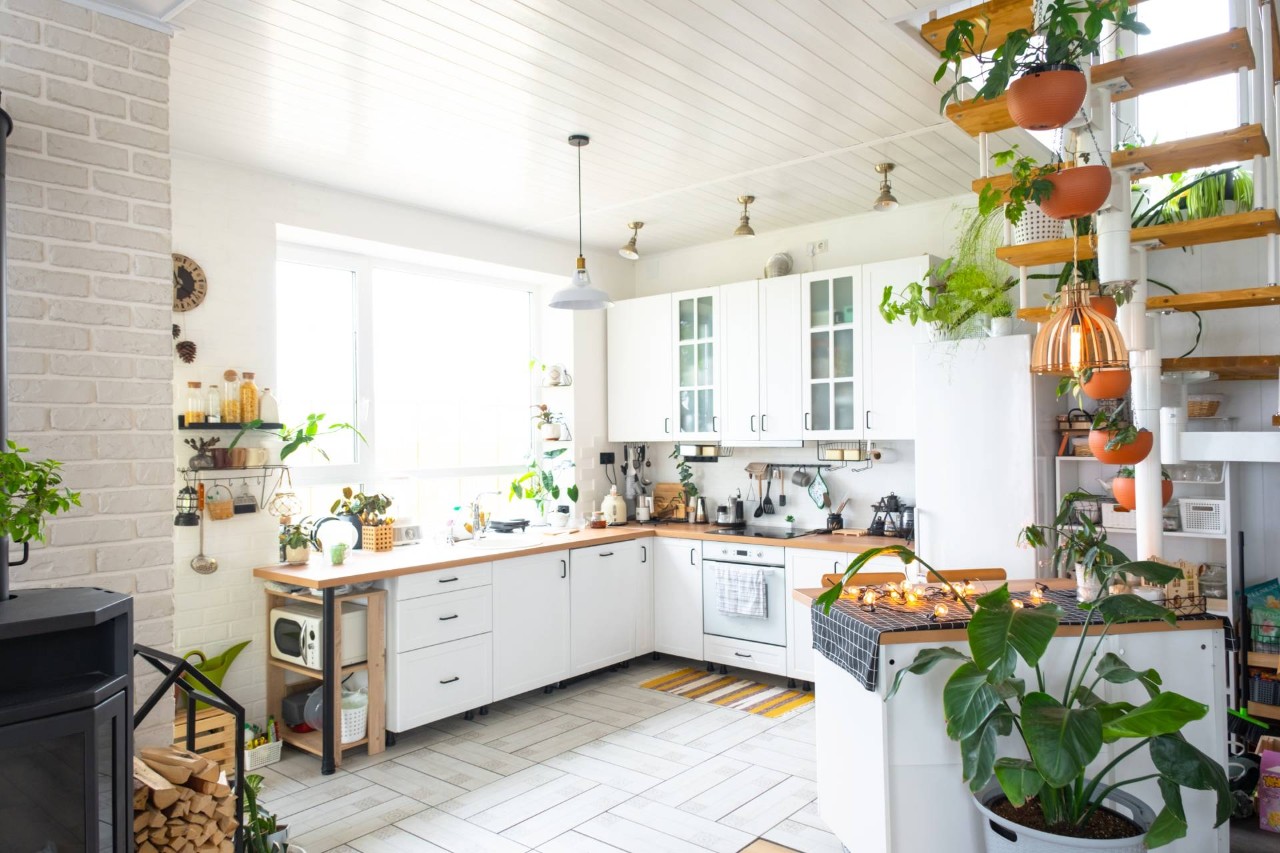 Home kitchen decorated in the cottage style with large windows and bright colors near El Dorado, California