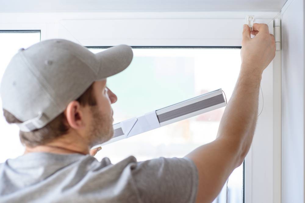 Window treatment repairman installing new shades near El Dorado, California (CA)